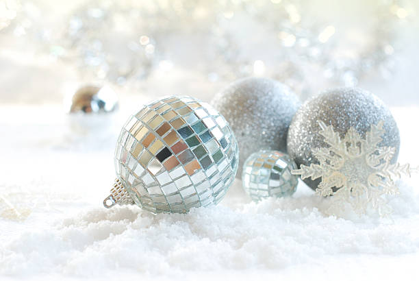 istock Christmas, New Year silver ball, snow on white silver background 497357298
