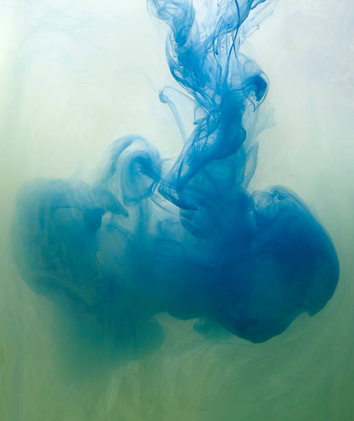 Mixing acrylic paints in water.