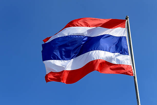 istock Waving Thai flag with blue sky background 497370473