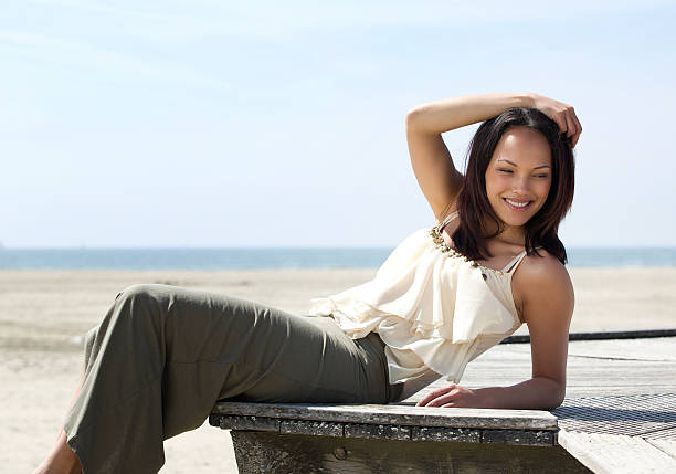 istock Young asian woman posing outdoors 497370551