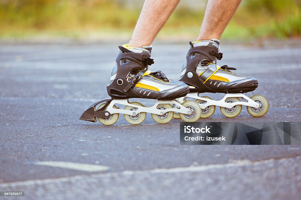 Male skater Close-up view of male legs in roller blades. Close-up Stock Photo