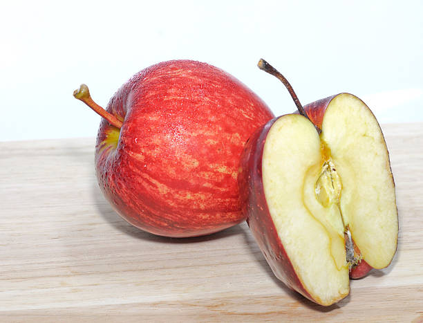 istock fresh apple isolated on wooden base 497370935