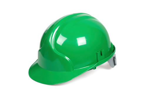 Green hard hat isolated on white with clipping path.