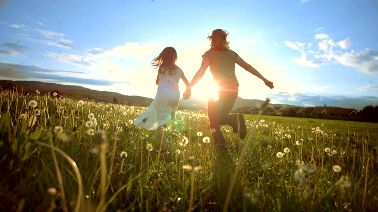 SUPER SLO MO Mother And Daughter Running To The Sun