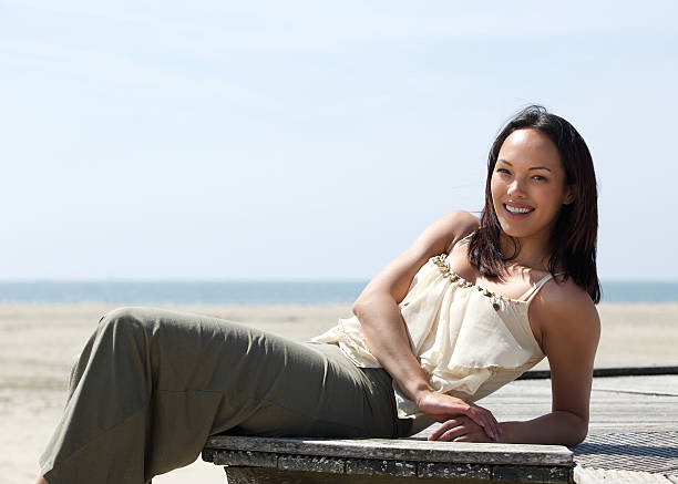 istock Pretty young woman relaxing outdoors 497376751