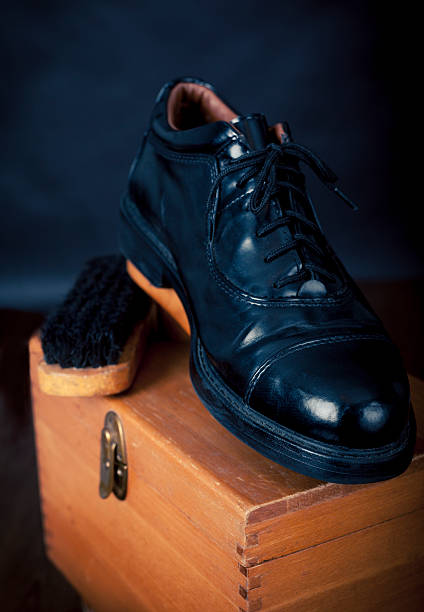 Men's Black leather Dress Shoe On Old Shoeshine Box Men's Black leather Dress Shoe On Old Shoeshine Box shoe polish stock pictures, royalty-free photos & images