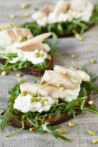 istock open sandwiches with cottage cheese and fish 497380254