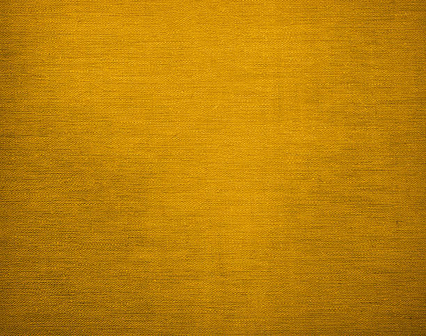 istock Canvas grunge background texture in elegant golden colour 497380322