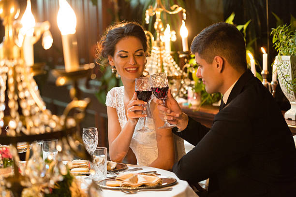 istock Bride and groom toasting at wedding 497380856
