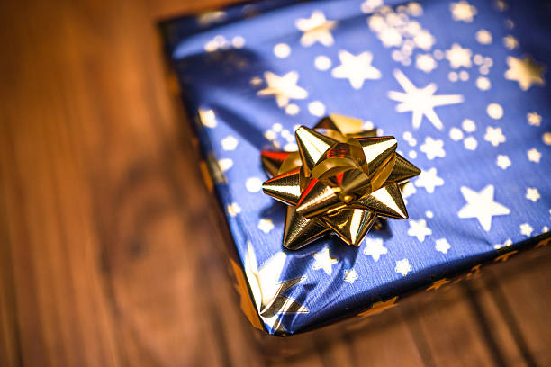 istock various christmas gift in a plank wood table 497384566