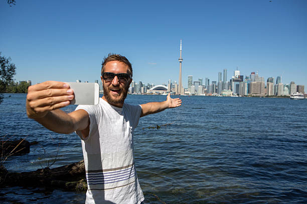 istock Tourist in Toronto-Canada taking a selfie portrait 497387374