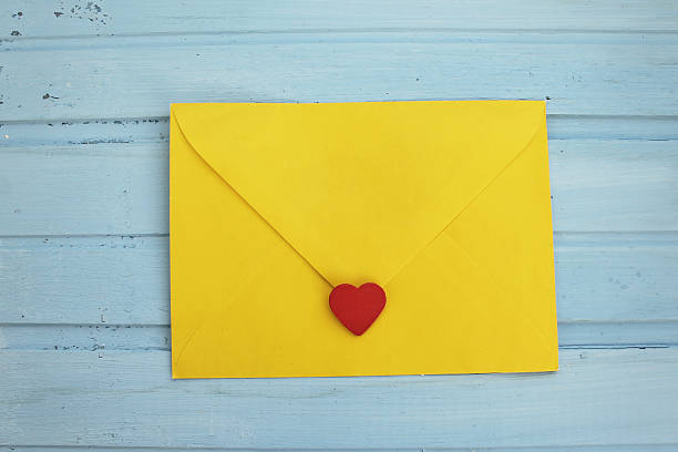 istock Yellow love letter on blue background 497388460