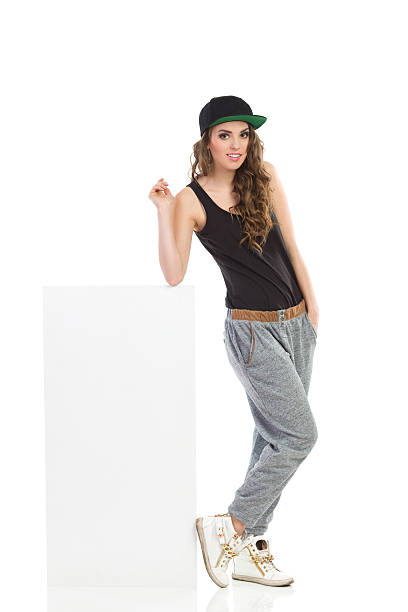 istock Cool girl lean on the white box 497389827