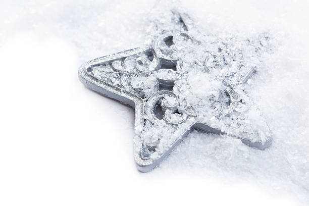 istock snowflake christmas decoration in white snow isolated 497390336