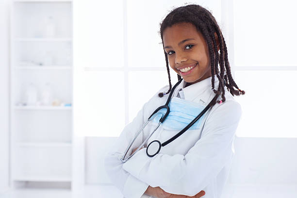 istock African American little doctor looking at camera. 497390494