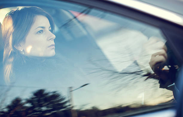 istock Serious woman driving a car. 497390734