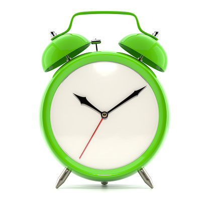 Alarm clock on white background with shadow. Vintage style green color clock with black hands.