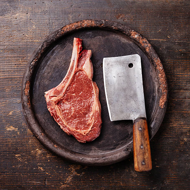 istock Raw meat and meat cleaver 497392057
