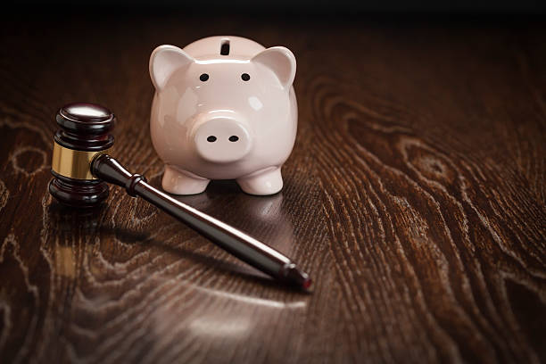 istock Gavel and Piggy Bank on Table 497393445
