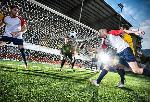 istock Football match in stadium: Header goal 497393595