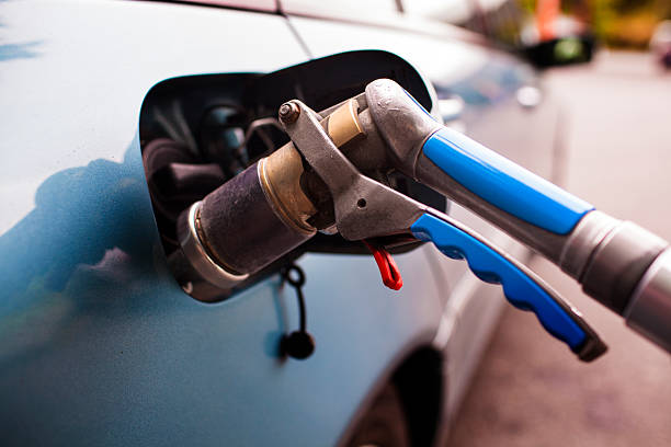 Refuelling LPG Refueling  car with LPG gas at a station liquefied petroleum gas stock pictures, royalty-free photos & images