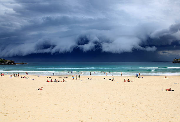 Bondi Beach - Sydney Australia. Beach goers enjoy the last rays of sunshine before a massive storm sweeps through Sydney