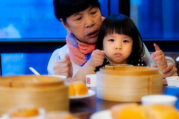 istock Asian family celebrating a birthday 497394191