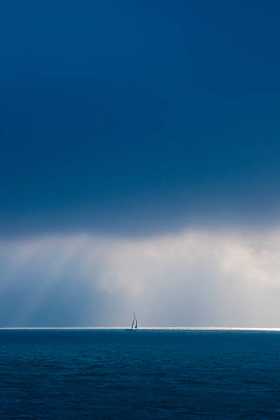 istock Sailboat in a Dimmed Day at Open Sea 497394675
