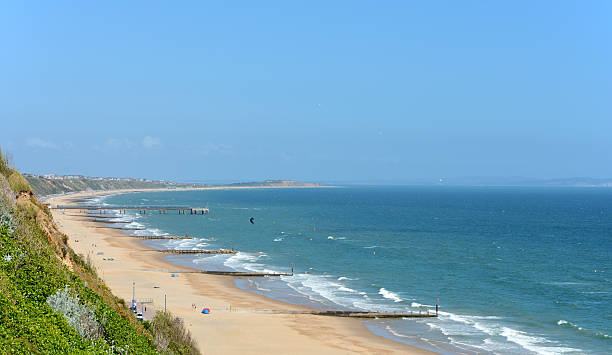 Boscombe to Hengistbury Head Part of Bournemouth Beach showing Boscombe Pier to Hengistbury Head. Popular tourist destination and beuaty spot. Perfect copy space in the sky. boscombe photos stock pictures, royalty-free photos & images