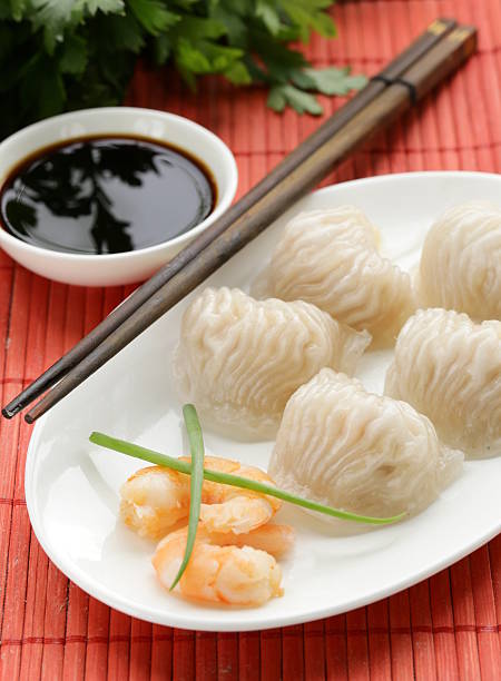 istock Asian steamed meat dumplings dim sum with soy sauce 497394881