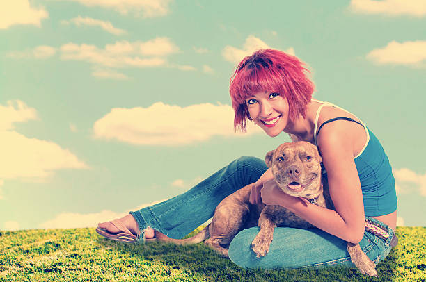 istock Beautiful Woman and Pit Bull mix dog 497394913