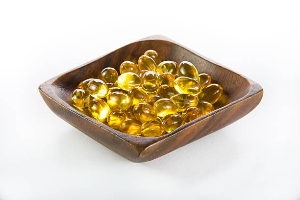 ケープコッドの肝臓オイル、omega3 、ビタミン d - fish oil healthy eating capsule isolated ストックフォトと画像