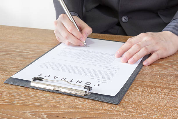 istock business man signing contract 497409824