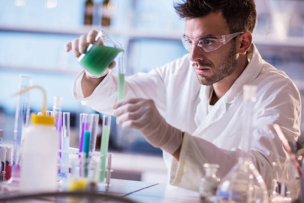 istock Male chemist working on chemical substances in a laboratory. 497409936