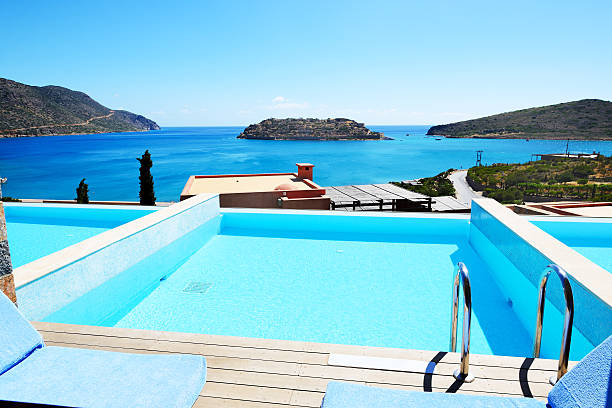 istock Swimming pool with a view on Spinalonga Island 497411441
