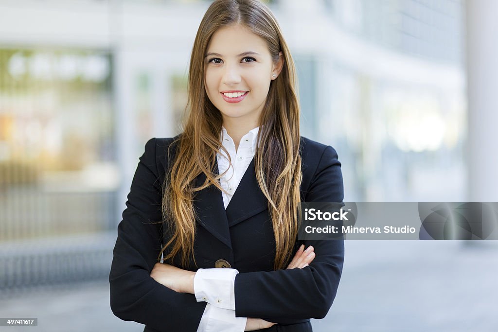 Smiling businesswoman in urban setting Portrait of a young smiling business woman outdoor Adult Stock Photo