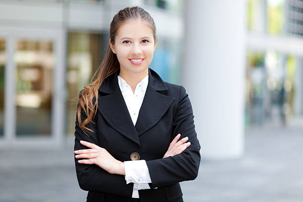 istock Smiling businesswoman in urban setting 497411625