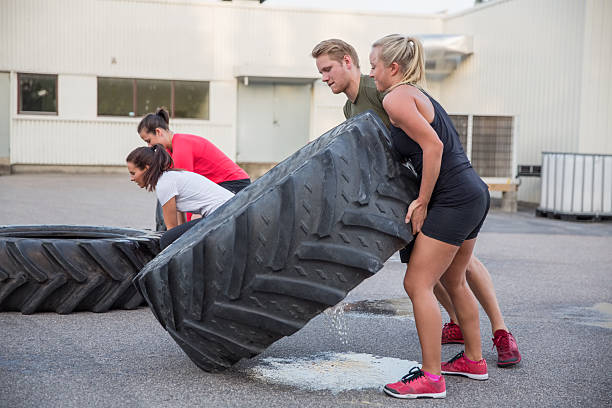 istock Flipping tractor tires as outdoor workout 497411911