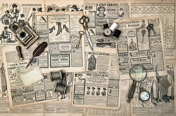 antique accessories, sewing and writing tools, vintage fashion magazine for the woman. retro style toned picture