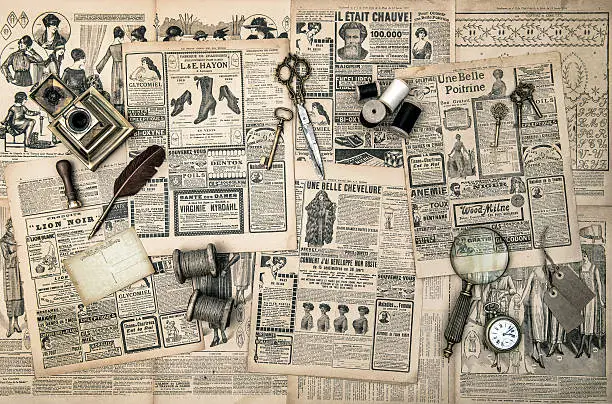 Photo of sewing and writing tools, vintage fashion magazine