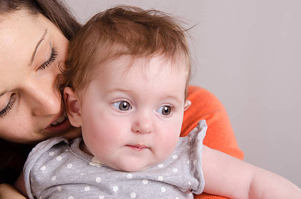 istock Happy mother hugging her daughter 497412739