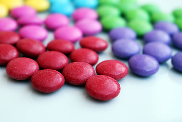 Detail of tasty colorful chocolate smarties group stock photo