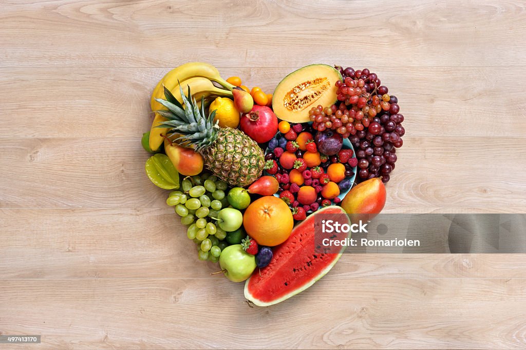 Heart symbol. Only fruits Heart symbol / studio photography of heart made from different fruits - on white background. High resolution product. Heart Shape Stock Photo