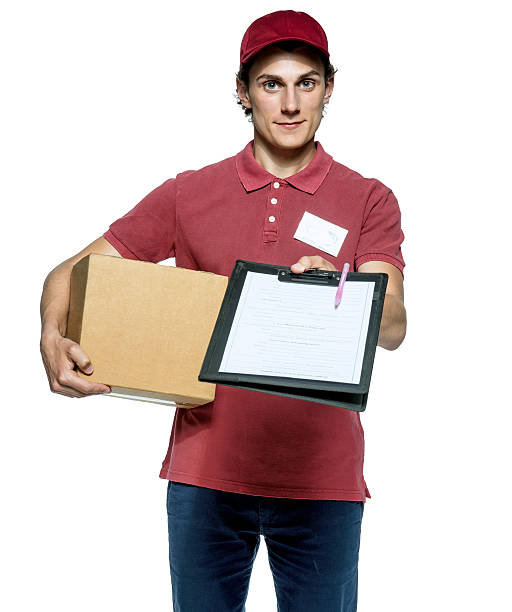 istock Young delivery man holding a cardbox 497413420