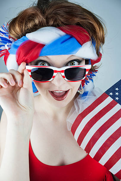 istock Woman holding American flag 497413603