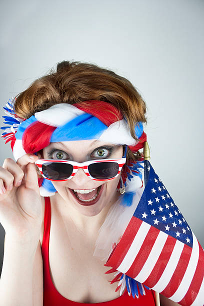 istock Woman holding American flag 497413621
