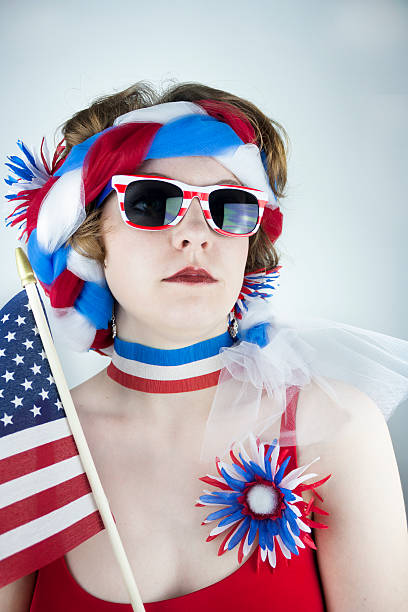 istock Woman holding American flag 497413631