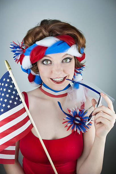 istock Woman holding American flag 497413639