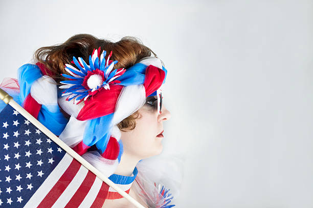 istock Woman holding American flag 497413649