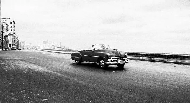 Old Chevy driving along the Malecon in Havana.